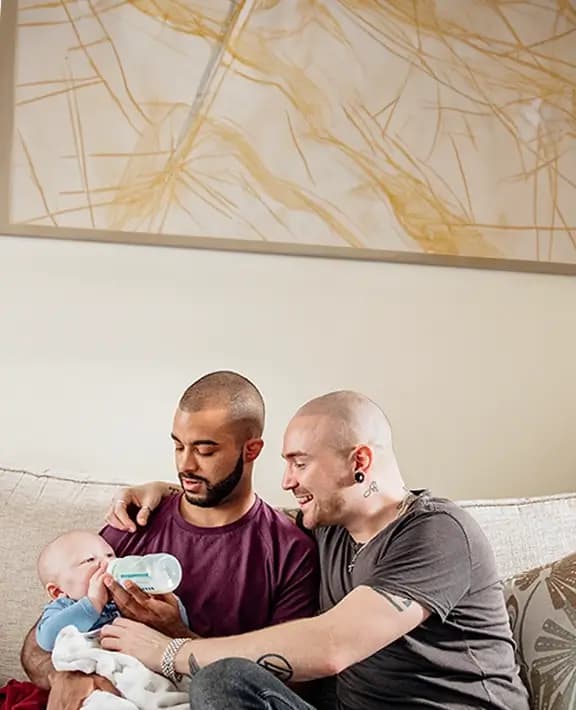 Two men with a baby